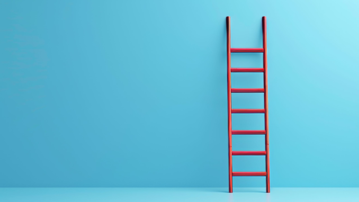 A striking red ladder set against a vibrant blue background, symbolizing challenges and the journey towards achieving goals, representing ambition and perseverance in a visually compelling manner